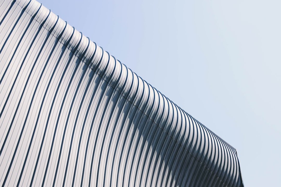 gray-and-white-building-roof-at-day-time-uun-2ixjva